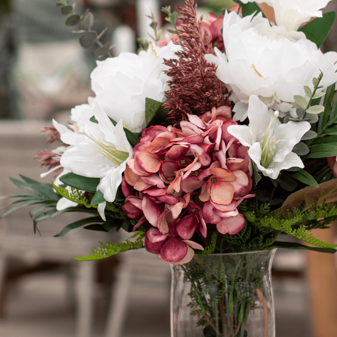 186 Elegant floral arrangement with white lilies and pink hydrangeas in a clear vase, perfect for home decor.