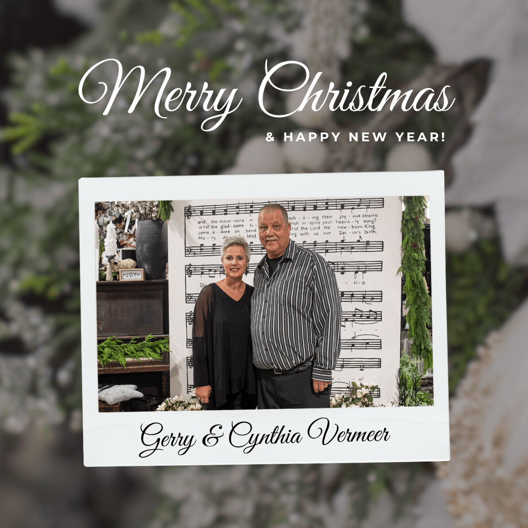 Couple posing for a Christmas photo with musical background and festive decor. Text: Merry Christmas & Happy New Year!