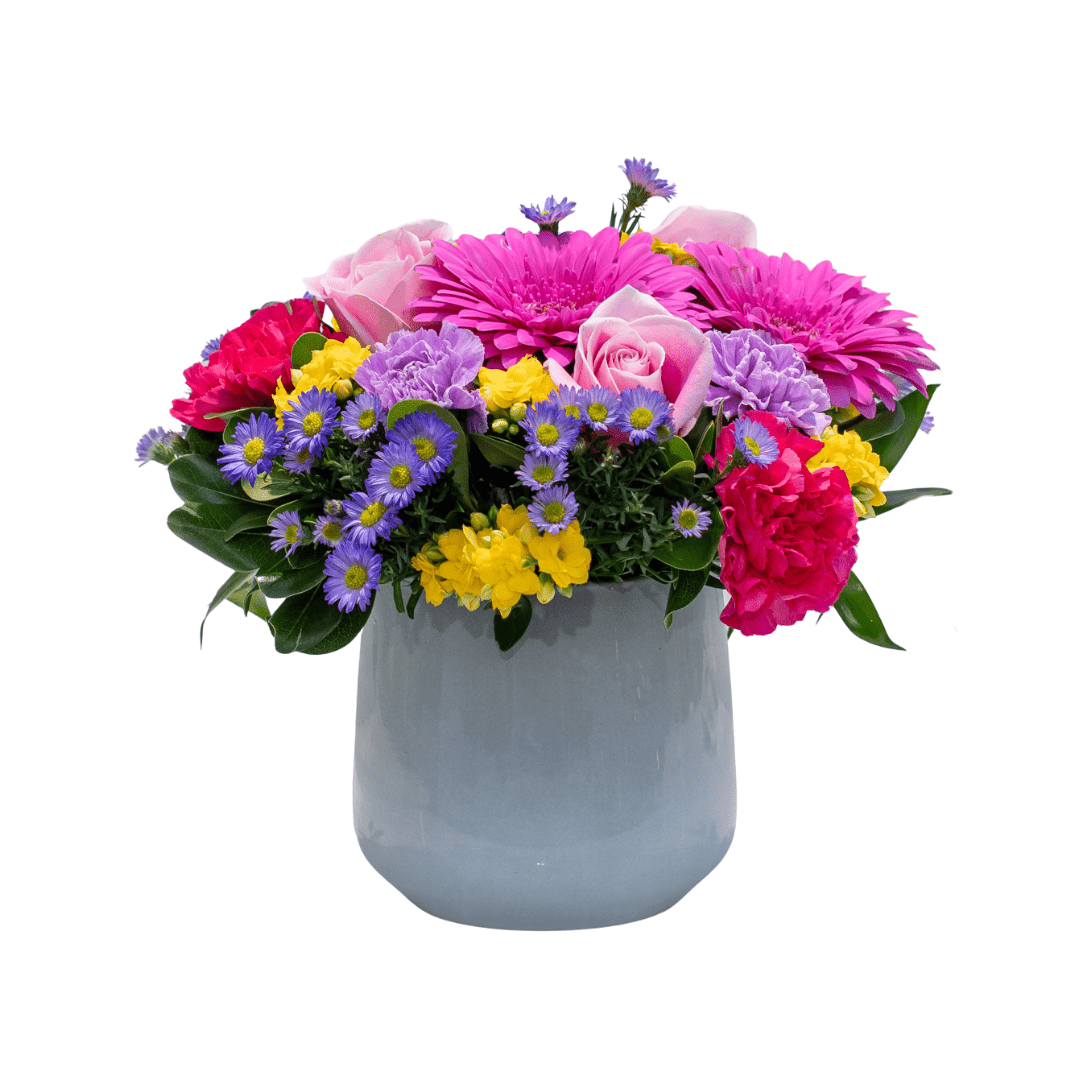 480 Colorful floral arrangement with pink, yellow, and purple blooms in a white vase, perfect for home decor.