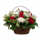 Basket of vibrant red and white flowers, including roses and daisies, with lush green foliage. Perfect for celebrations.