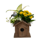 Rustic birdhouse planter with yellow flowers, ivy, leafy plant, and decorative bird. Ideal for garden decor.