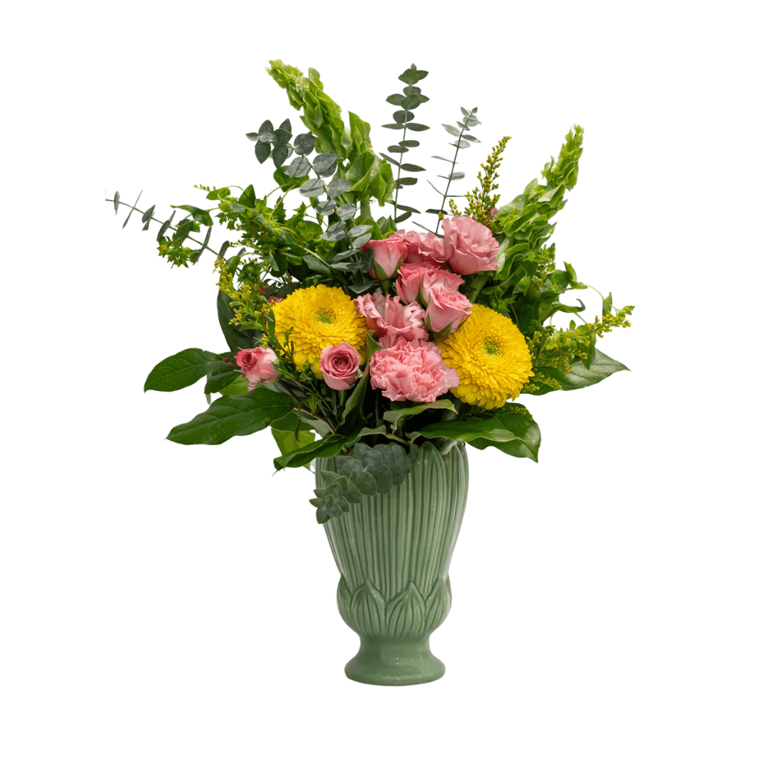 83 Elegant floral arrangement with pink roses, yellow flowers, and greenery in a decorative green vase.