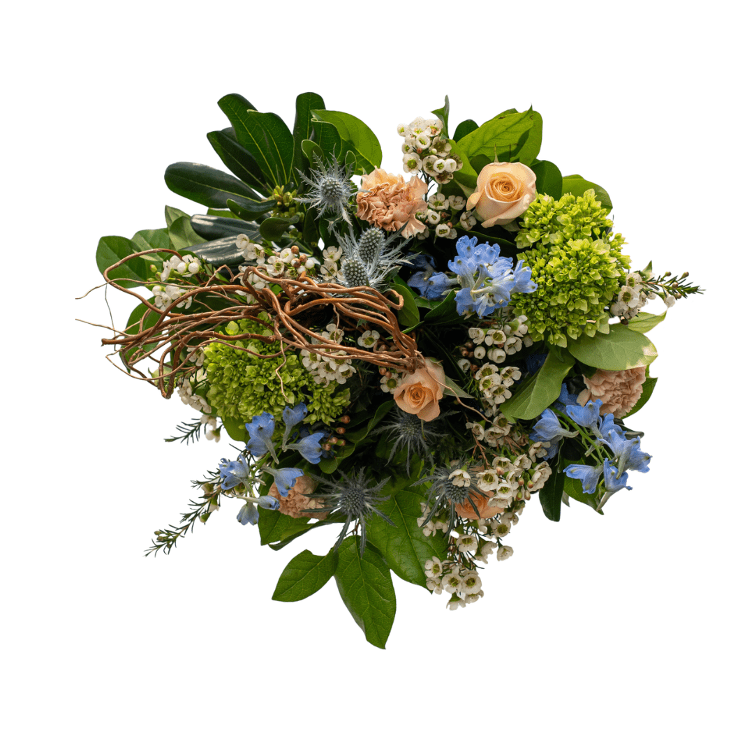 Mixed flower bouquet with peach roses, blue flowers, and green foliage on a white background. Perfect for decorations.