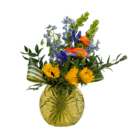 Vibrant floral bouquet with sunflowers, orange ranunculus, and blue flowers in a yellow glass vase.