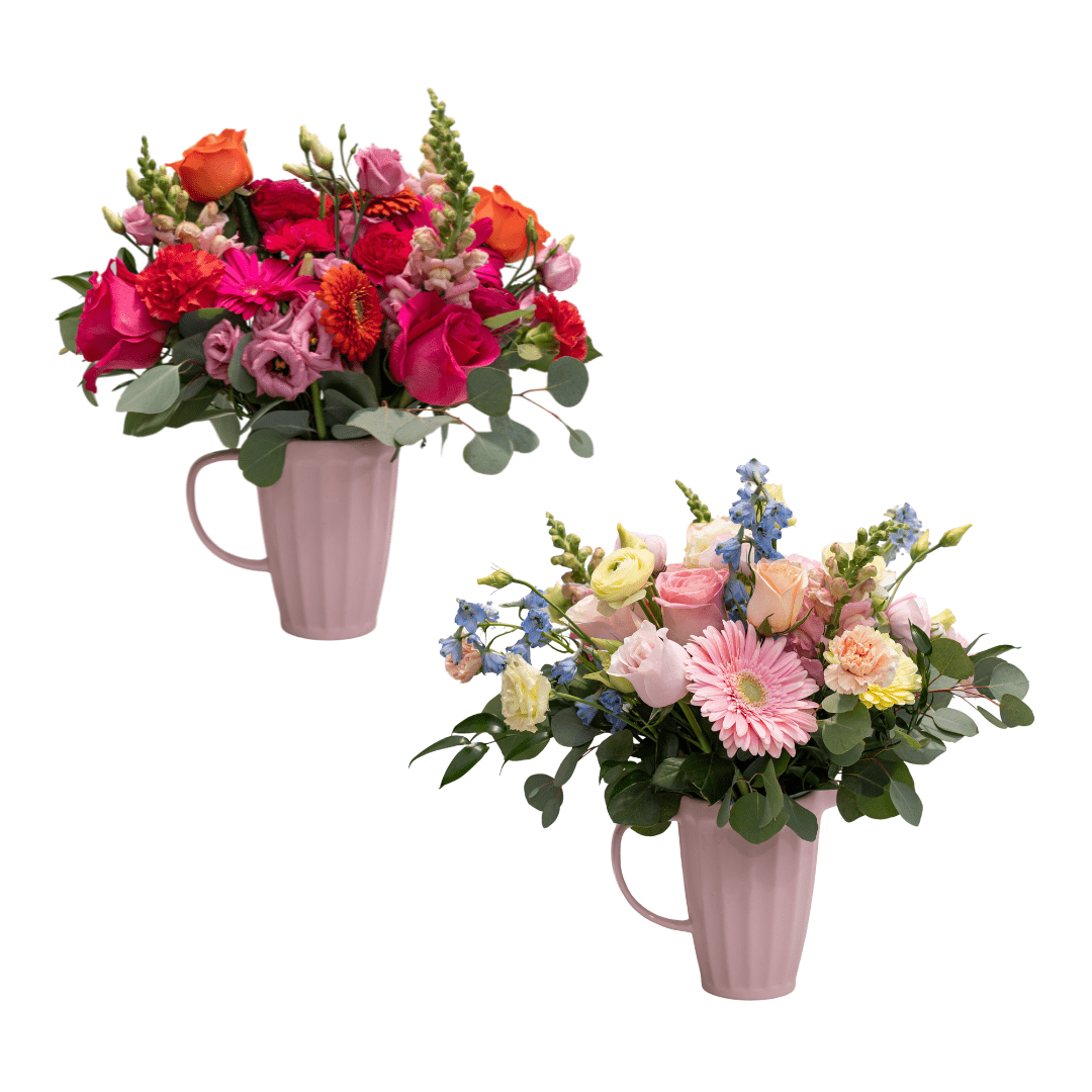 Two different fresh floral arrangements arranged in the same pink, ceramic jug. One arrangement has flowers that are bold pink and orange, while the other has pastel-coloured flowers in yellow, blue, and pink/peach.