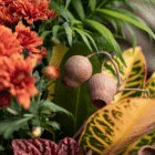 A close-up of silk bell cups in a fall-themed indoor mixed planter.