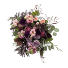 An above view of a berry-toned bouquet with roses, carnations, lisianthus, snap dragons, etc.